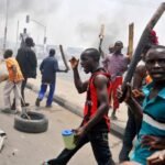 Erinje Crisis Deepens as Elders Call for Police Action Amid Youth Protests Over Vigilante Leader, Sunday Enisan.